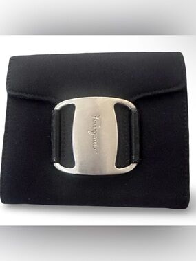 black Salvatore Ferragamo Vara canvas pouch with a silver-tone buckle.